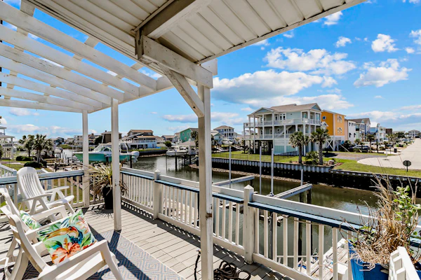 Waterfront home with Intracoastal views, outdoor areas, dock, & golf cart access