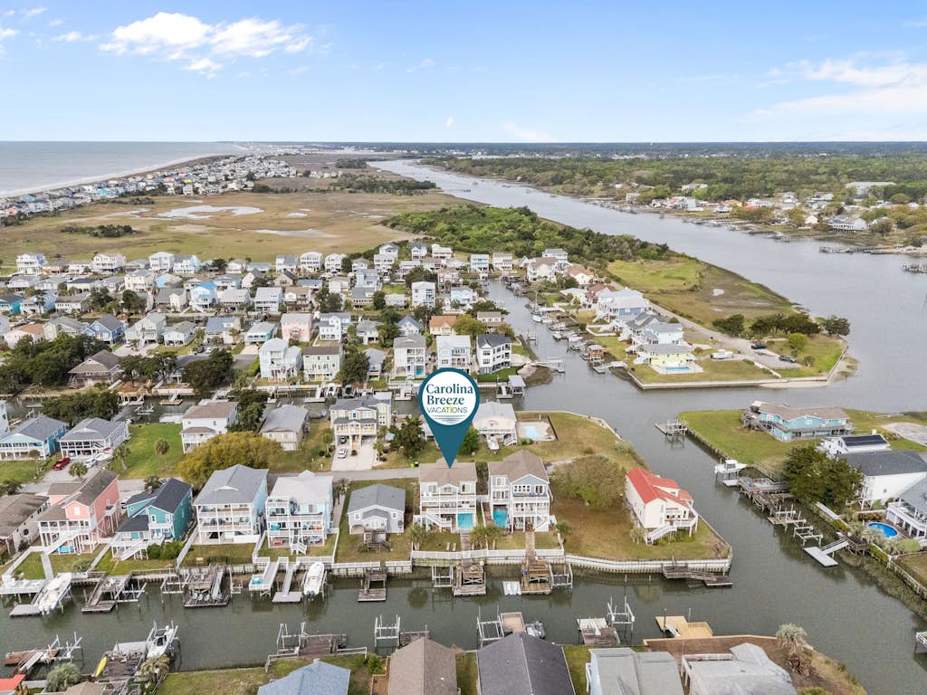 Waterfront house walkable to the beach with private dock, hot tub, pool & deck