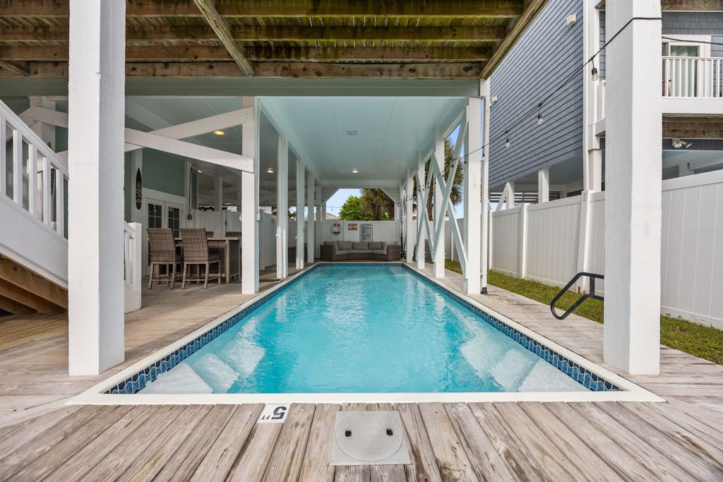 Waterfront house walkable to the beach with private dock, hot tub, pool & deck
