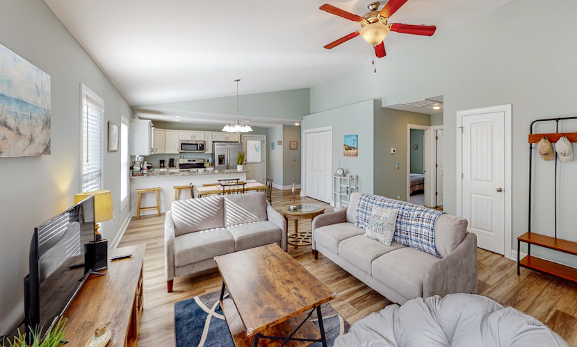 Updated home near the beach with fenced yard, grill, central AC, & washer/dryer