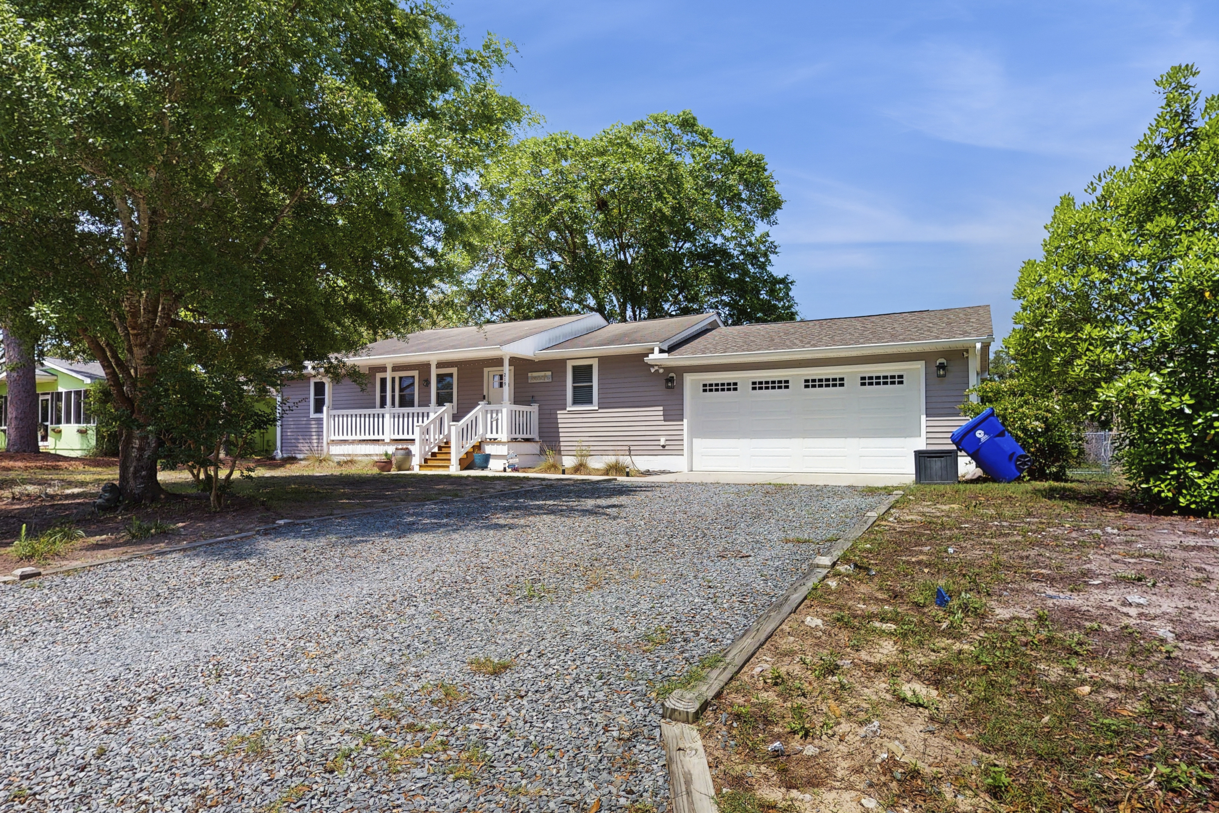 Serene home near the beach with enclosed yard, firepit, grill, bikes, AC, & W/D