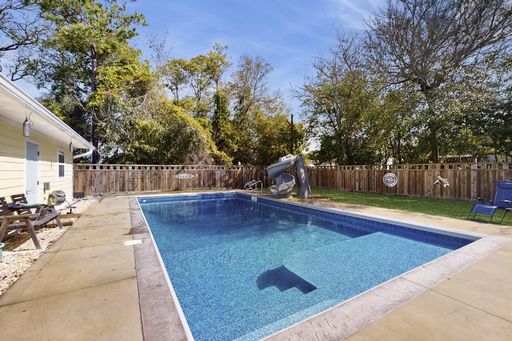 Coastal home with private pool and slide, close to beach and local attractions