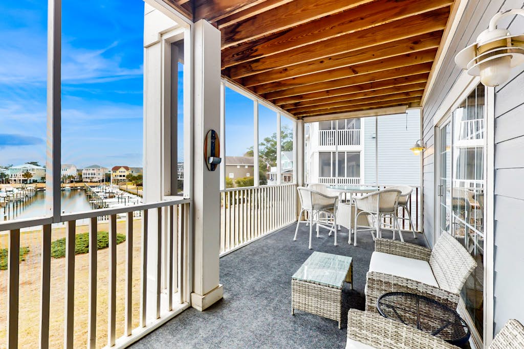 Spacious condo with marina & Intercoastal views, screened-in balconies, W/D & AC