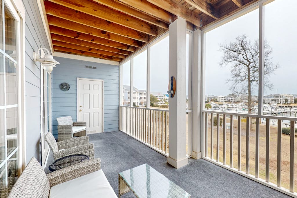 Spacious condo with marina & Intercoastal views, screened-in balconies, W/D & AC