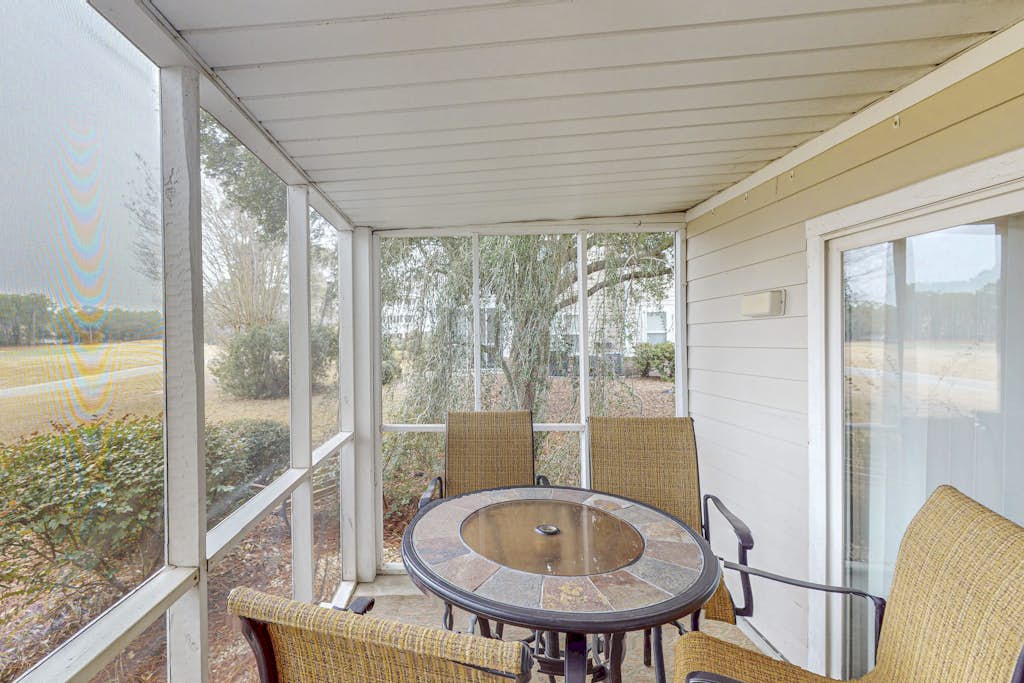 Coastal Condo with golf course view and shared pool access