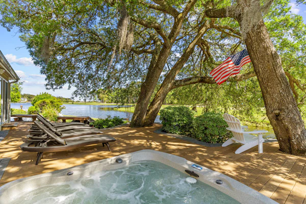 Gorgeous waterfront home with private hot tub, pool, views, deck, & fireplace