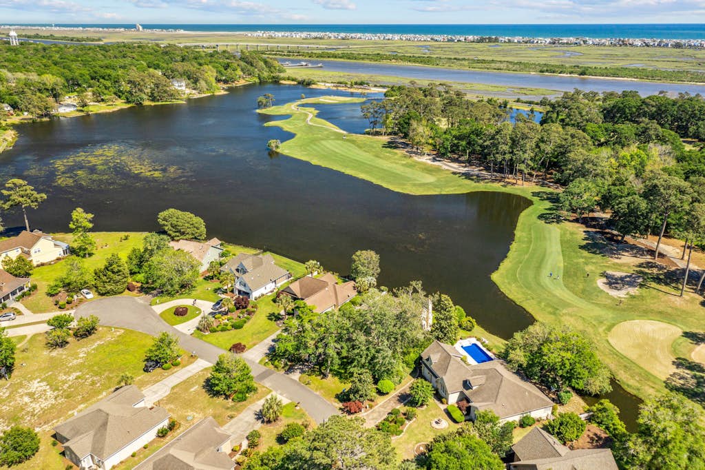 Gorgeous waterfront home with private hot tub, pool, views, deck, & fireplace