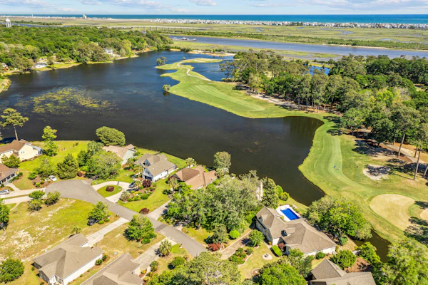 Gorgeous waterfront home with private hot tub, pool, views, deck, & fireplace