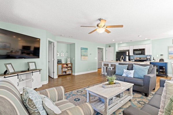 Beachside resort condo with screened balconies & golf