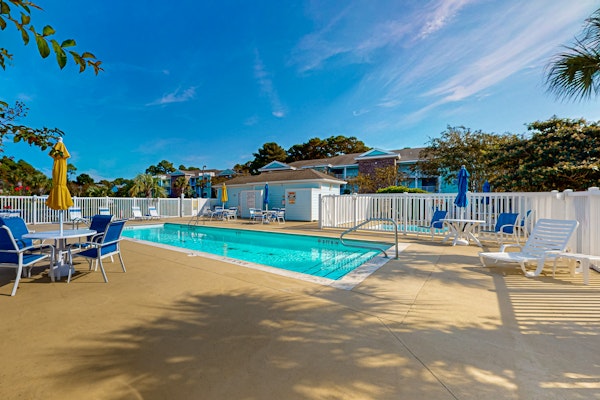 Coastal Condo with golf course view and shared pool access