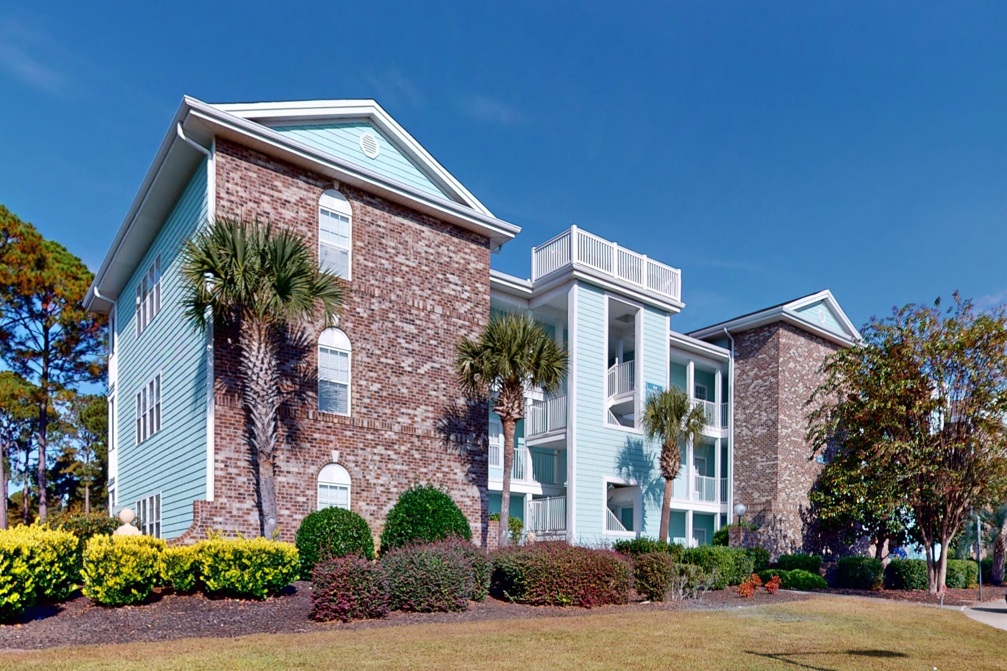 Coastal Condo with golf course view and shared pool access