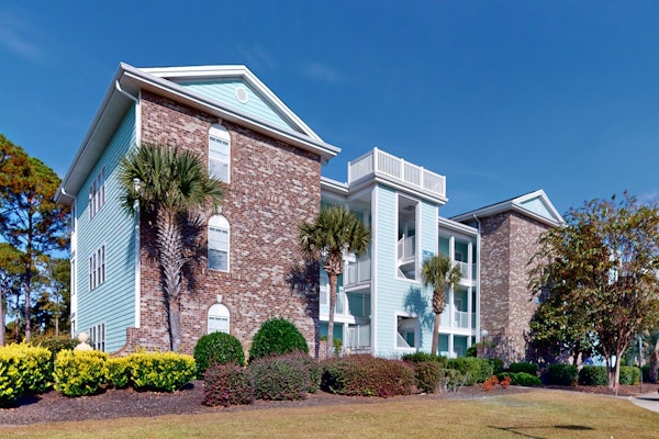 Coastal Condo with golf course view and shared pool access