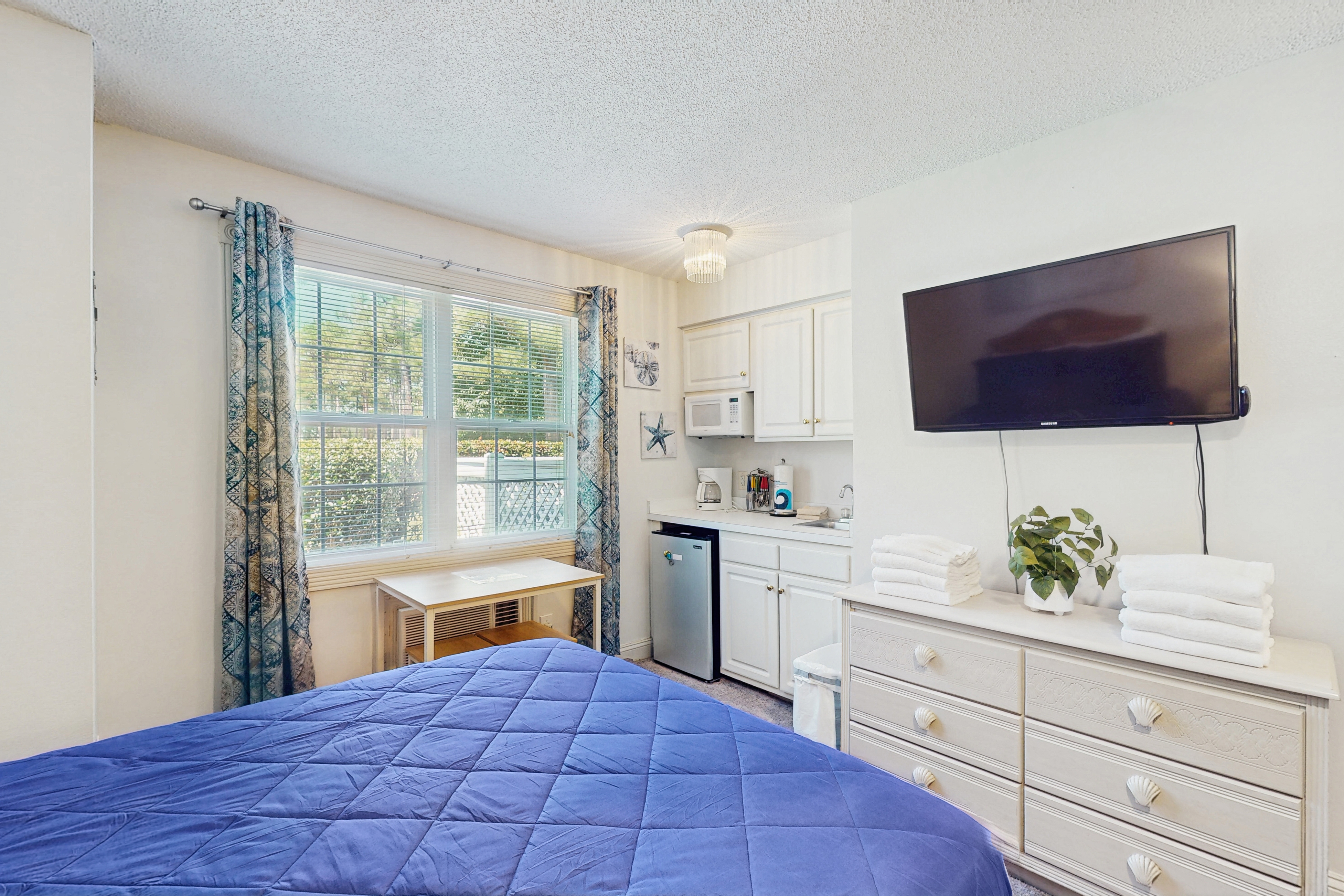 Coastal Condo with golf on-site, shared pool and fitness center