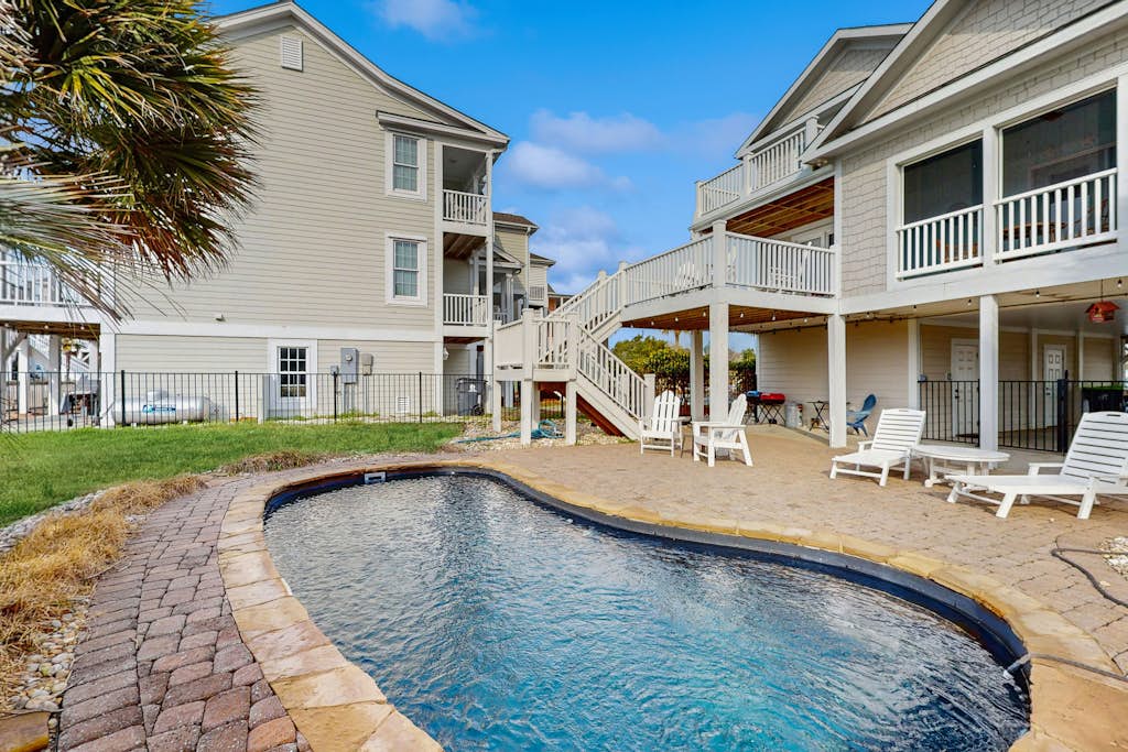 Waterway front home w/ private pool, fenced yard, boat dock, short walk to beach