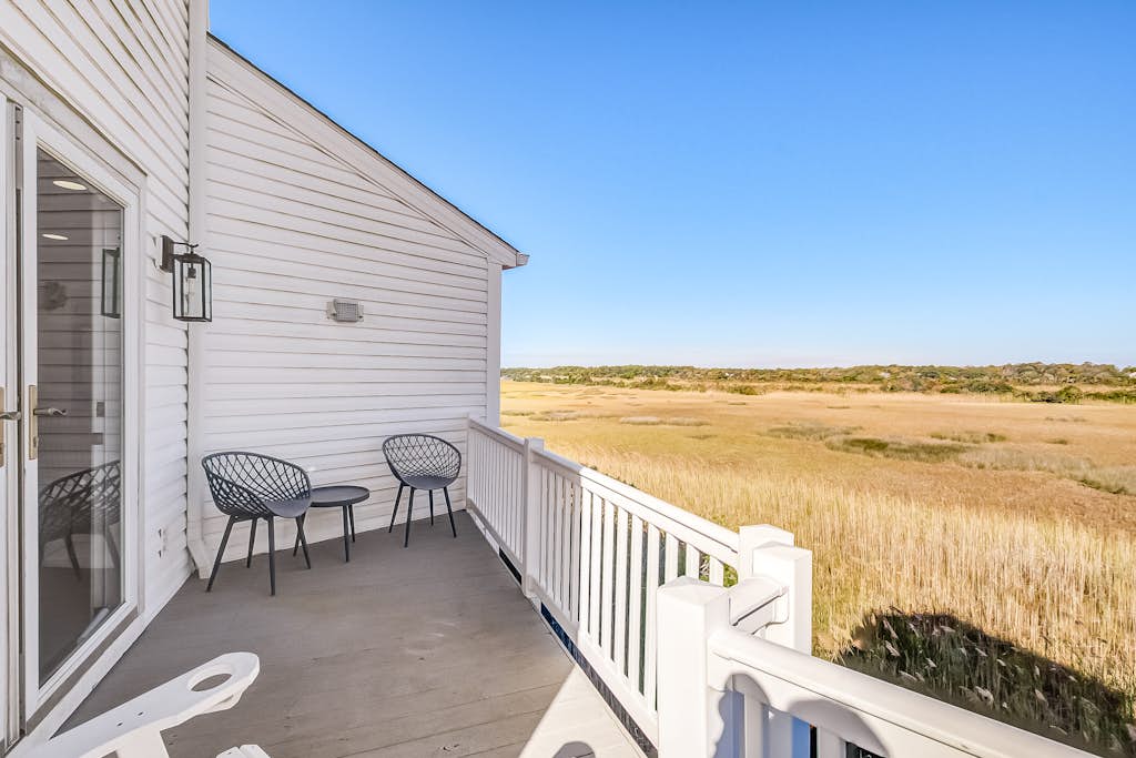 Designer, second-row home with elevator, marsh views, 2 living rooms & W/D