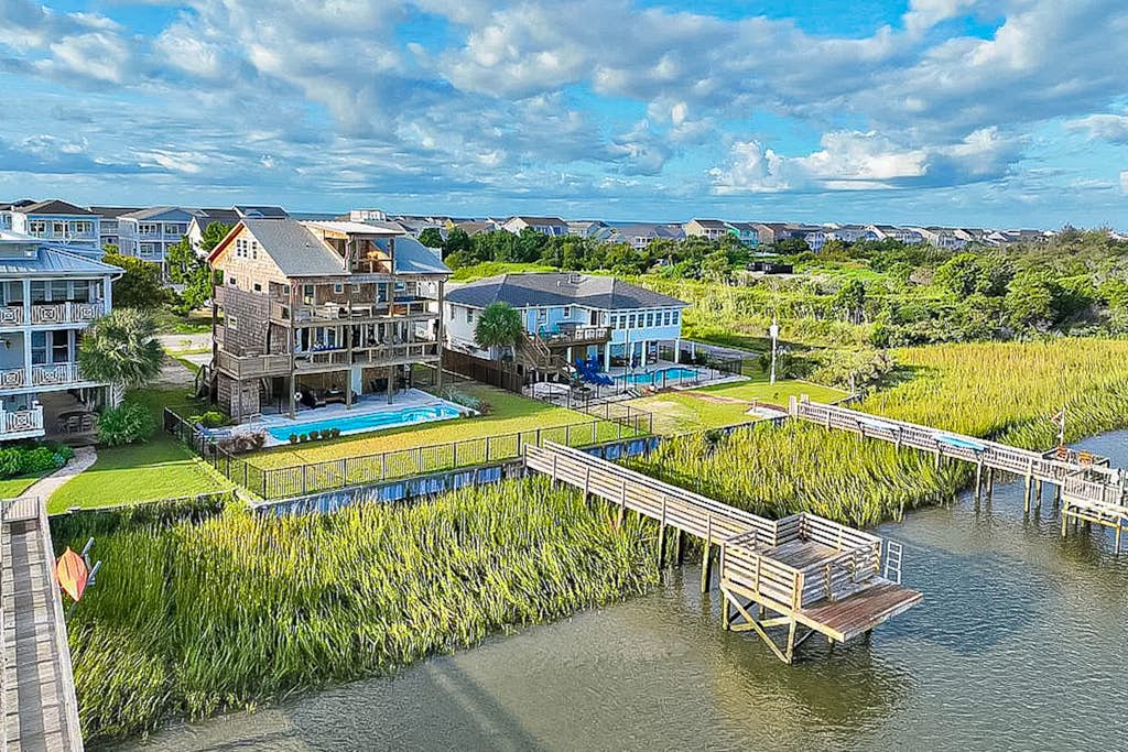 Custom home on the Intracoastal with water views, pool, dock, & decks