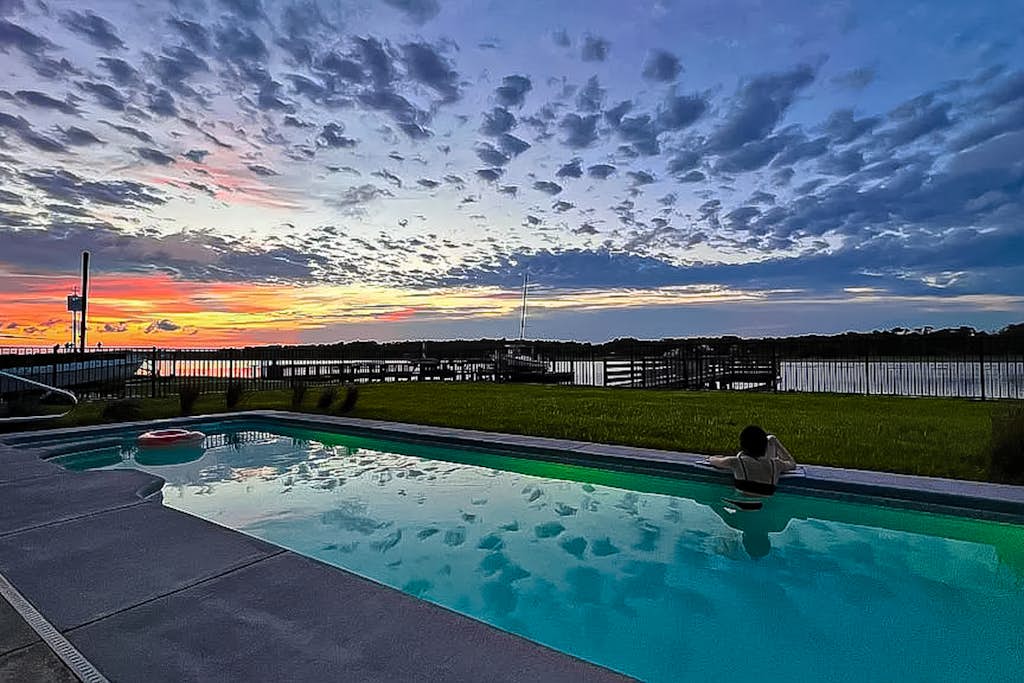 Custom home on the Intracoastal with water views, pool, dock, & decks