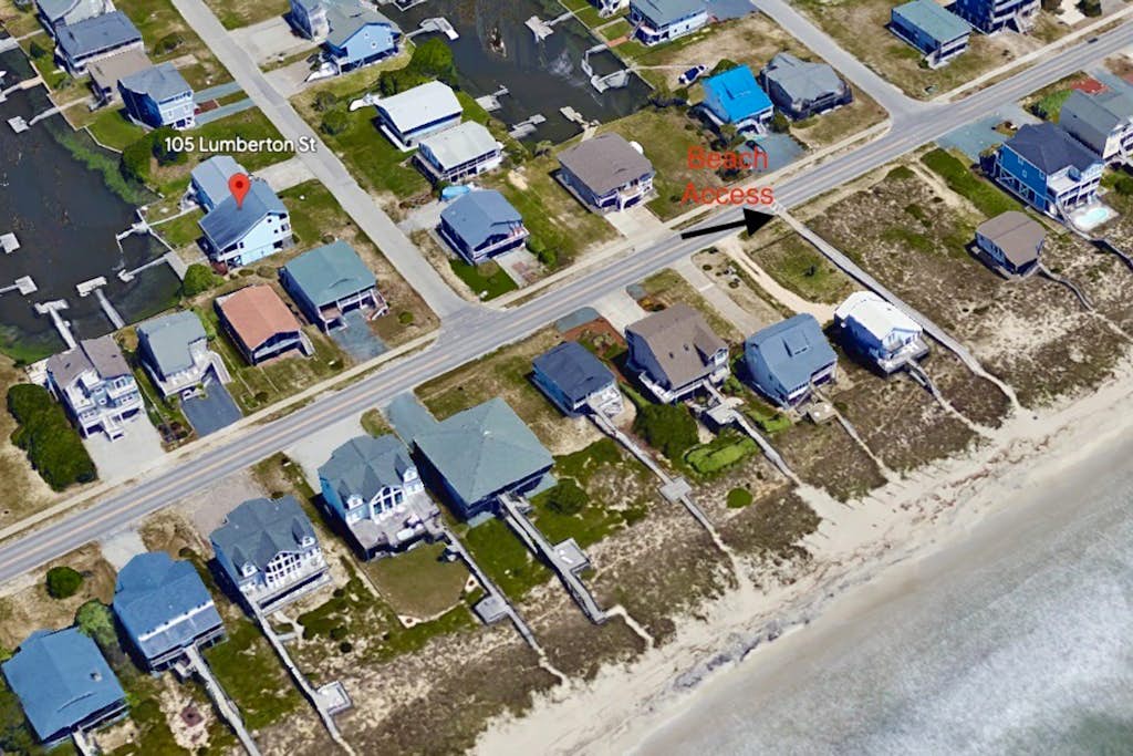 Canal-front, dog-friendly home with beach views, dock, balconies & beach access