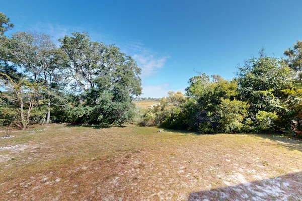 Walk to Beach | Marsh-View Escape with Screened Porch & Outdoor Shower