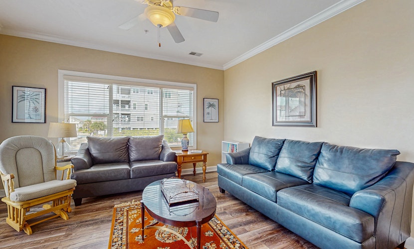 All-suite condo with private balcony & pond views - walk to beach