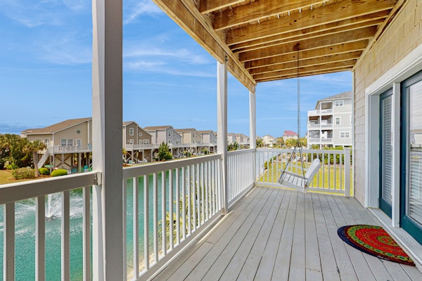 All-suite condo with private balcony & pond views - walk to beach