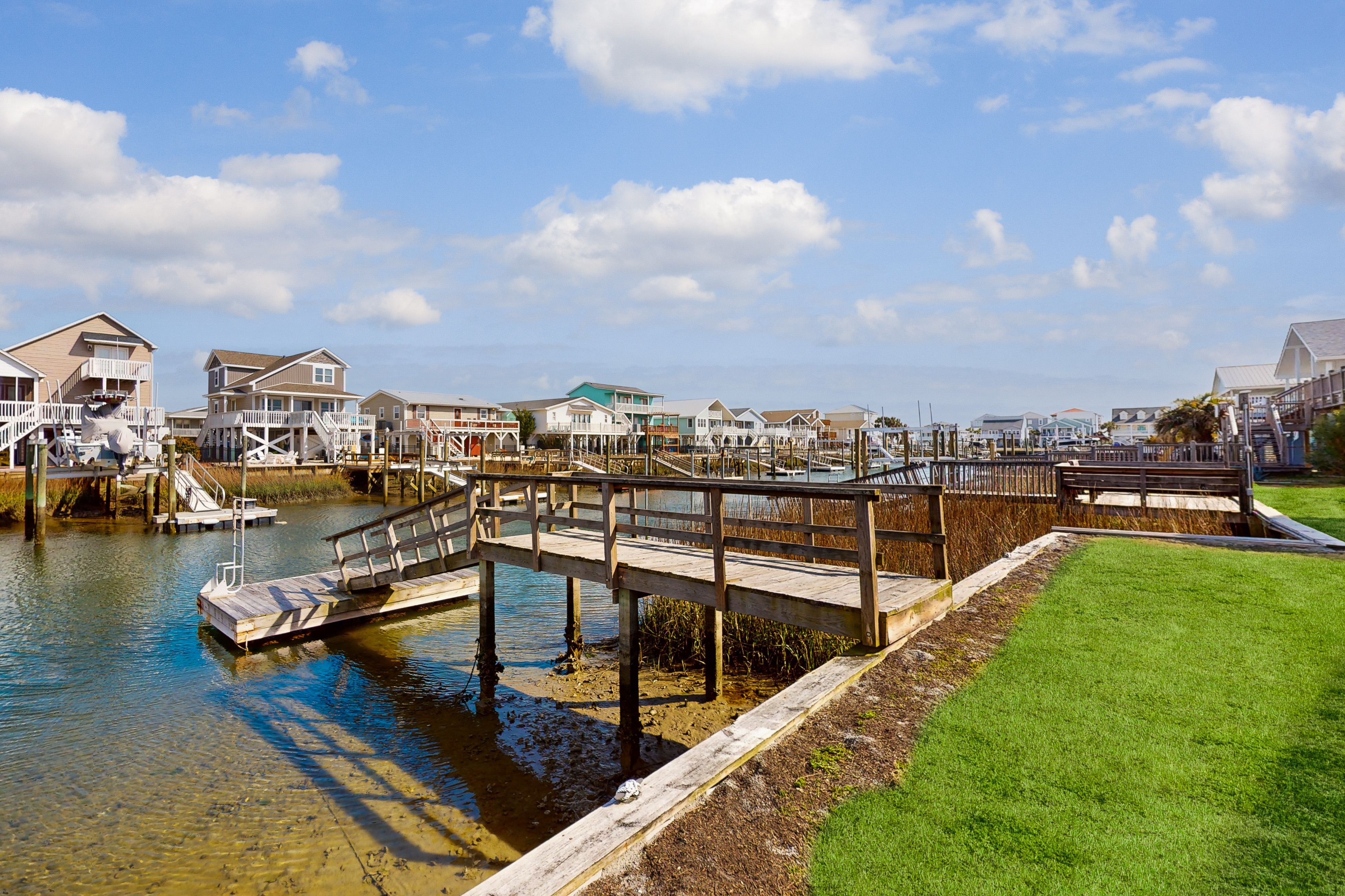 Canal front home with boat dock, dog friendly, short walk to beach
