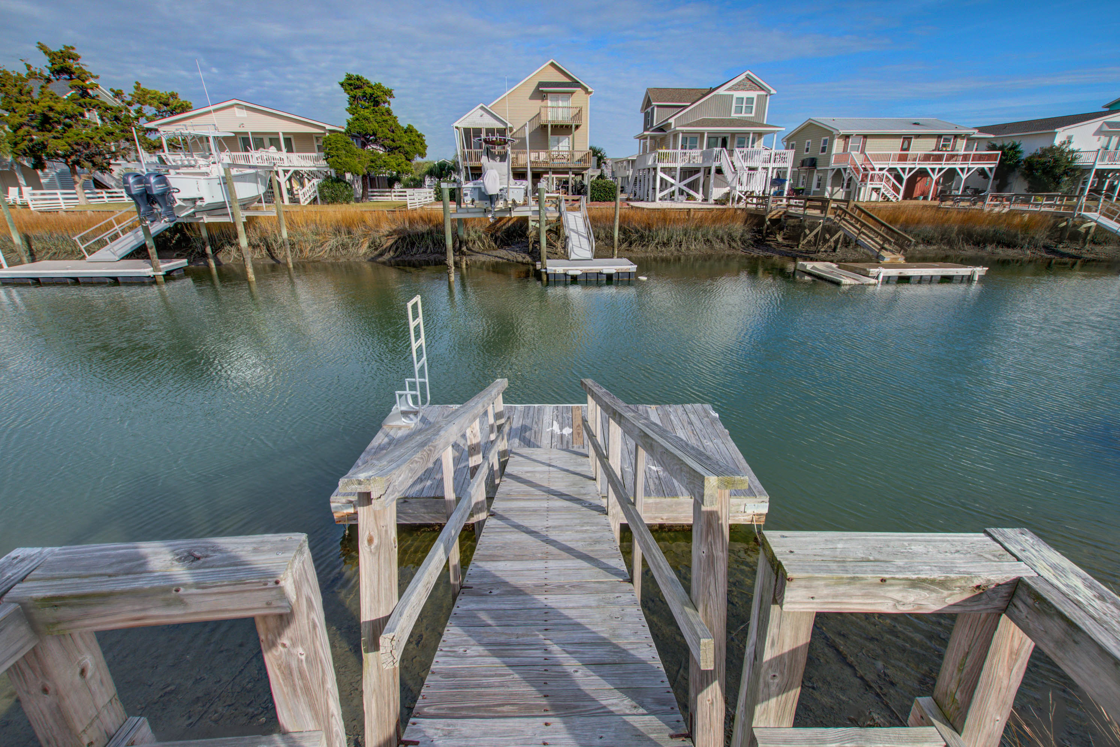 Canal front home with boat dock, dog friendly, short walk to beach