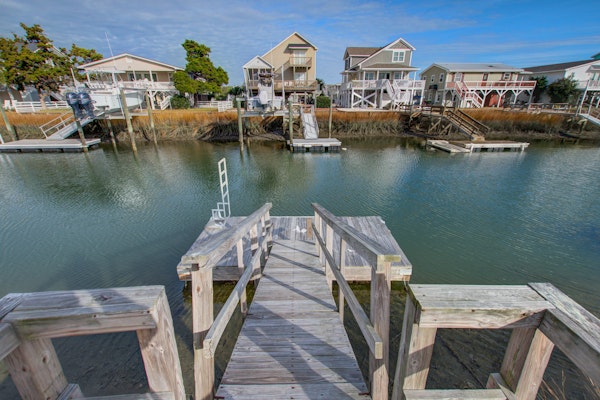 Canal front home with boat dock, dog friendly, short walk to beach