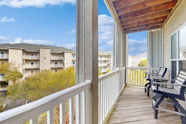 Sound side condo with sunset view balcony - close to pool, hot tub, and pier