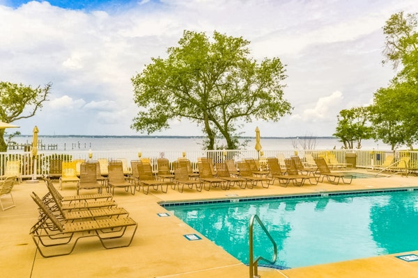 Sound side condo with sunset view balcony - close to pool, hot tub, and pier