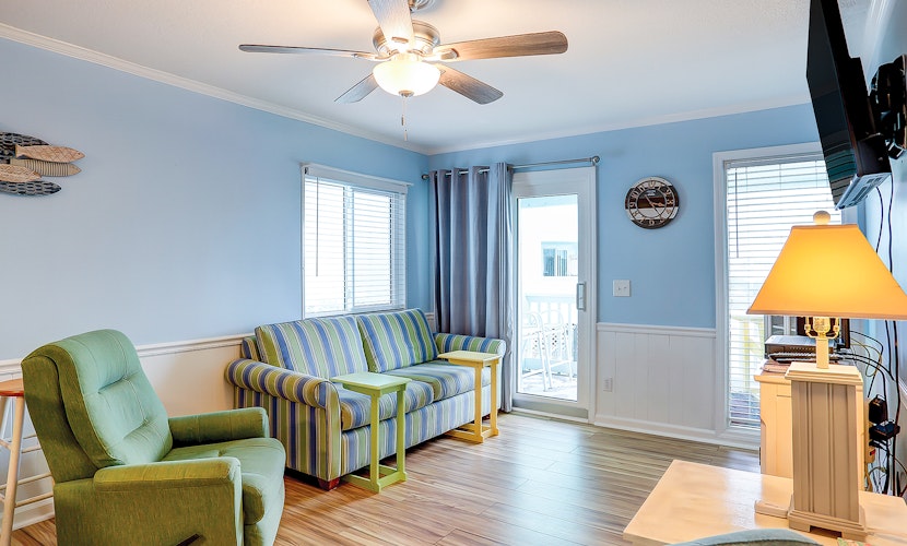 1st-floor pool-view condo with outdoor pool, beach access, balcony, W/D, & AC