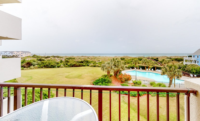 Inviting ocean view condo with balcony, pool, tennis, central AC, & W/D