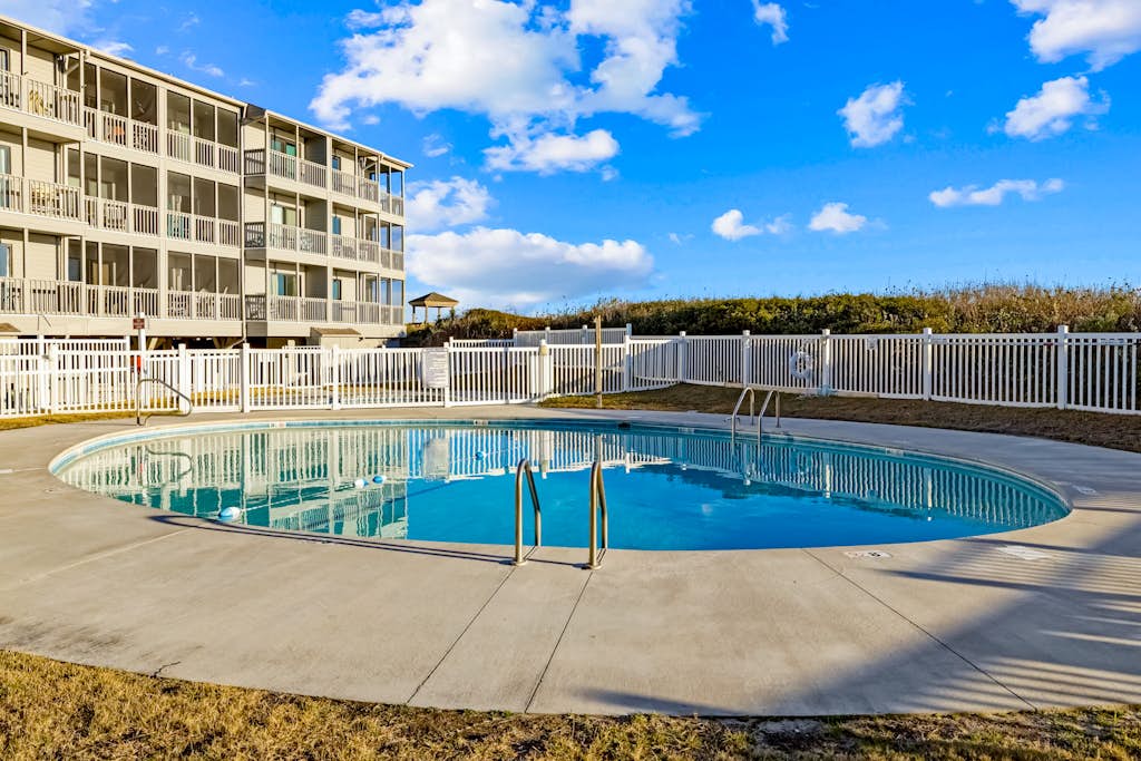 Oceanfront condo with shared pool, dock, grill, private balcony, & washer/dryer