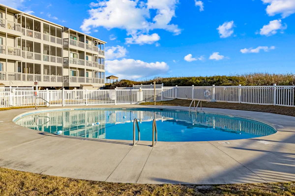 Oceanfront condo with shared pool, dock, grill, private balcony, & washer/dryer