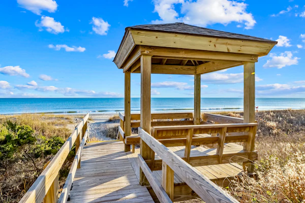 Oceanfront condo with shared pool, dock, grill, private balcony, & washer/dryer