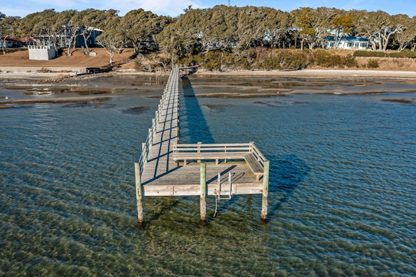 Three dog-friendly, waterfront cottages with full kitchens & private beach