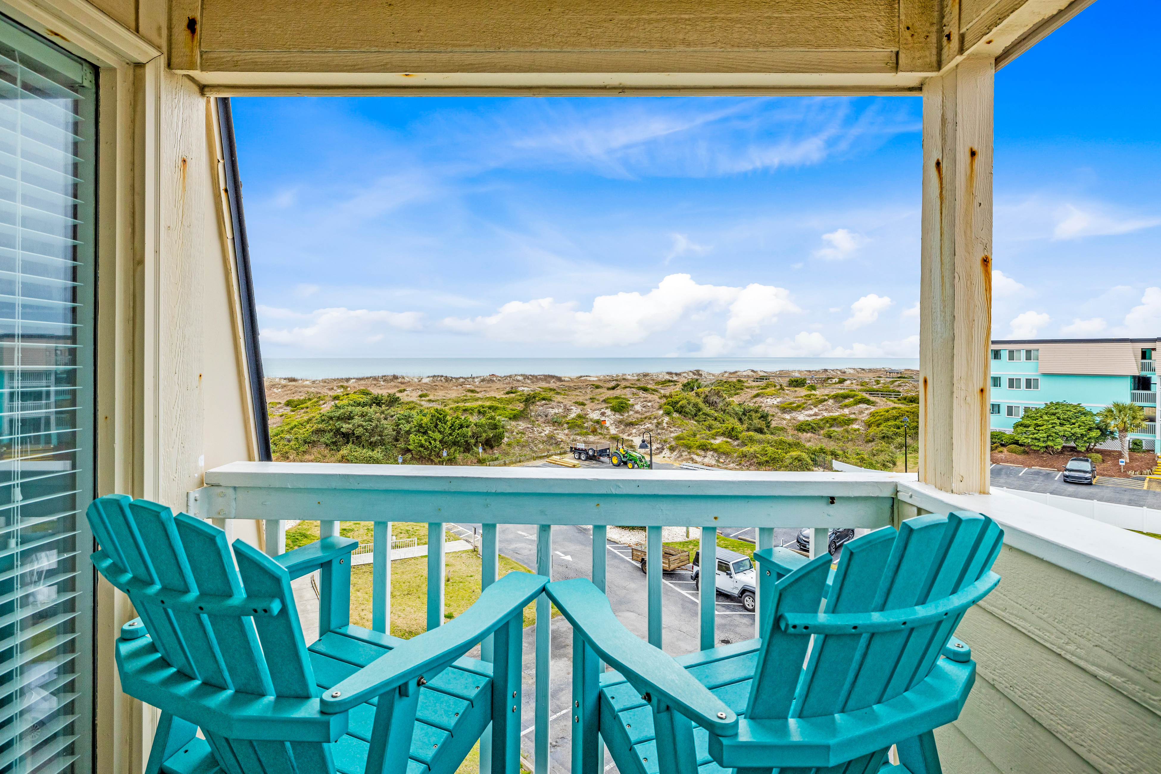 Beachfront home base with ocean-view balcony, 2 pools, waterslide & beach access