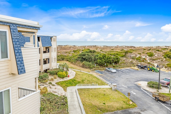 Beachfront home base with ocean-view balcony, 2 pools, waterslide & beach access