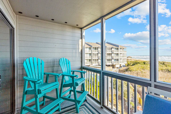Ocean-view condo with beachfront access, pool, fishing dock, & private balcony