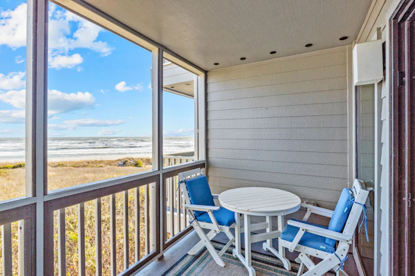 Ocean-view condo with beachfront access, pool, fishing dock, & private balcony