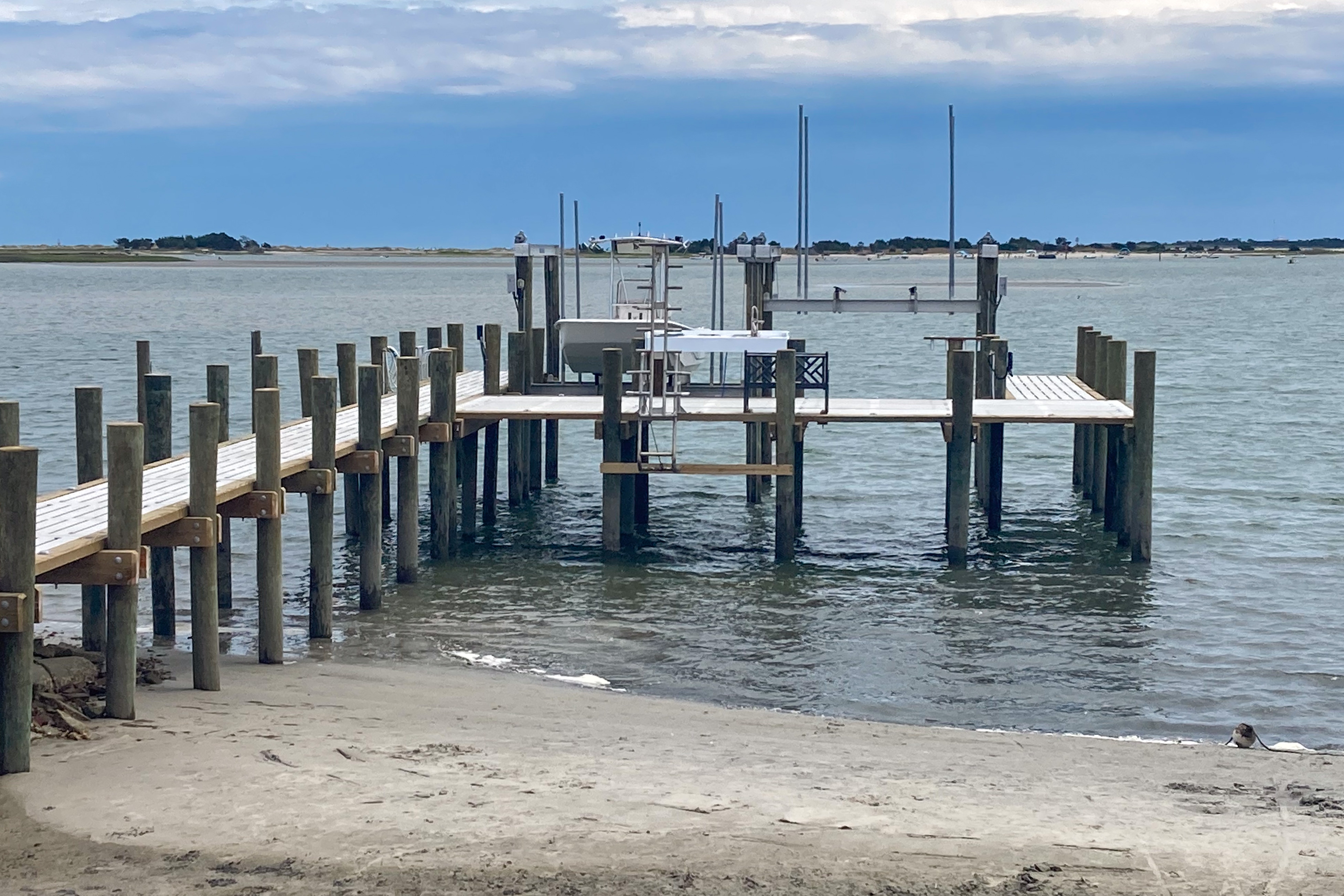 Stunning beachfront home with private dock, central AC & spacious deck