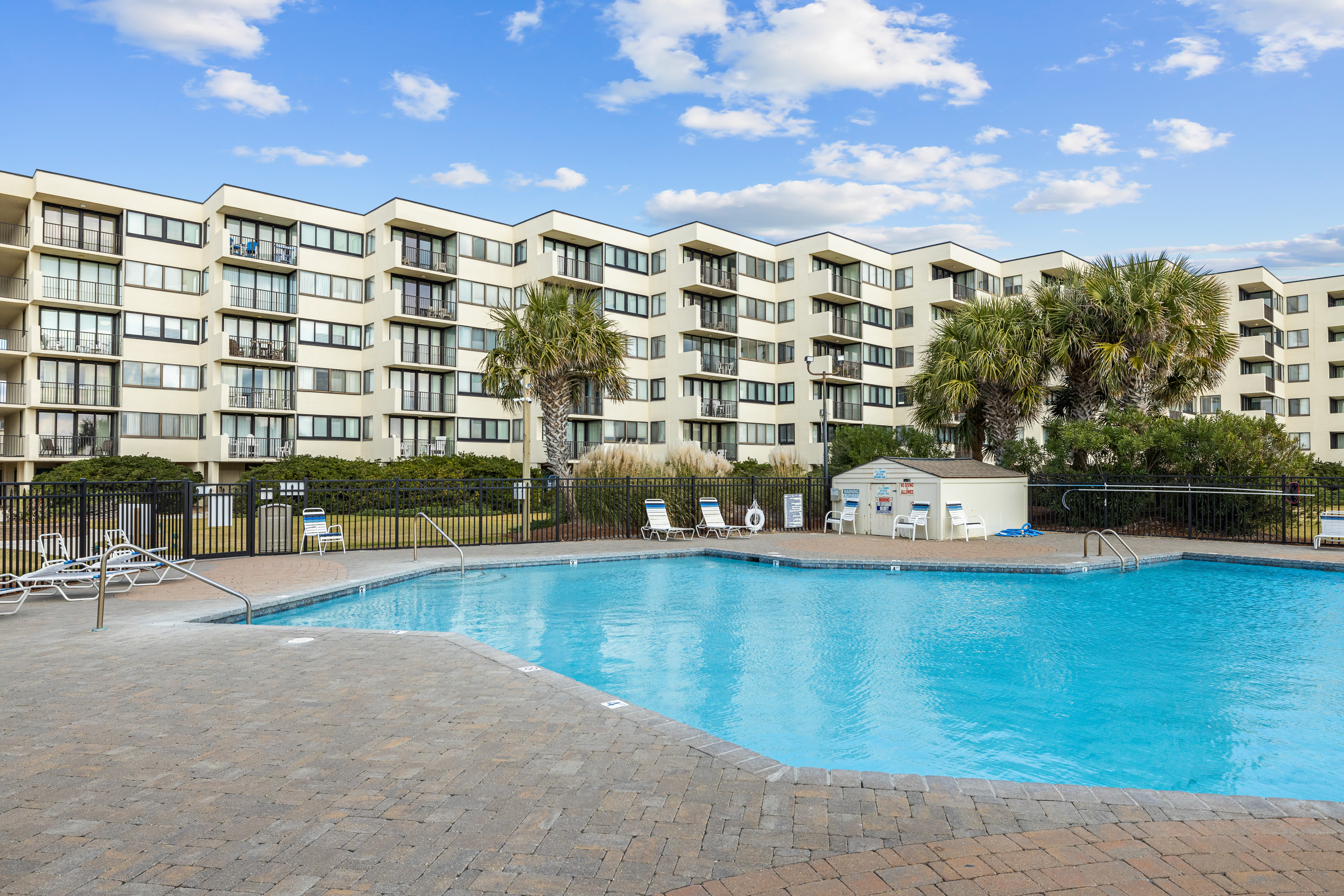 Beachfront condo with amazing ocean views, pool, tennis courts, & gym