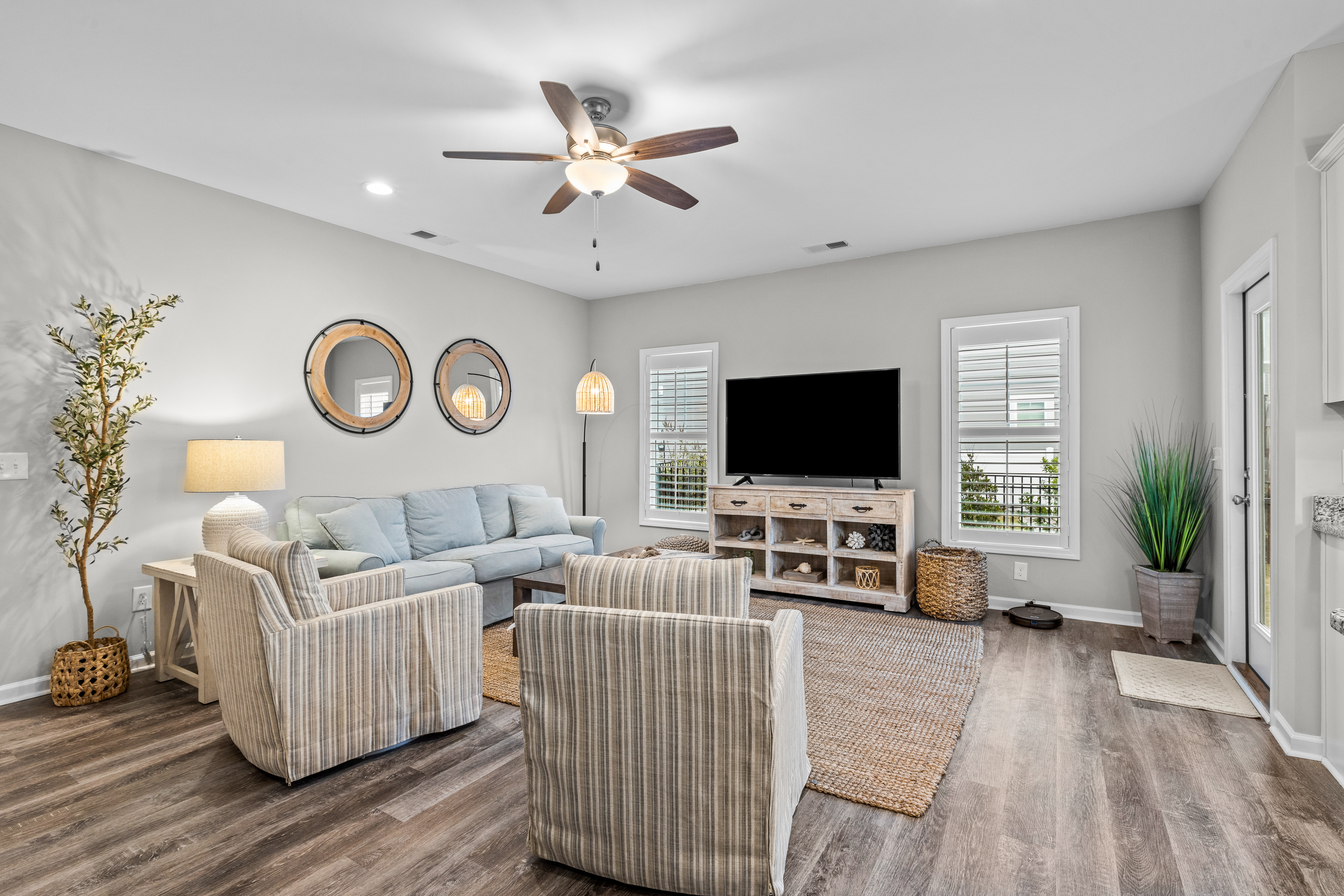 Coastal townhome with outdoor living, central AC, washer/dryer, & pool access