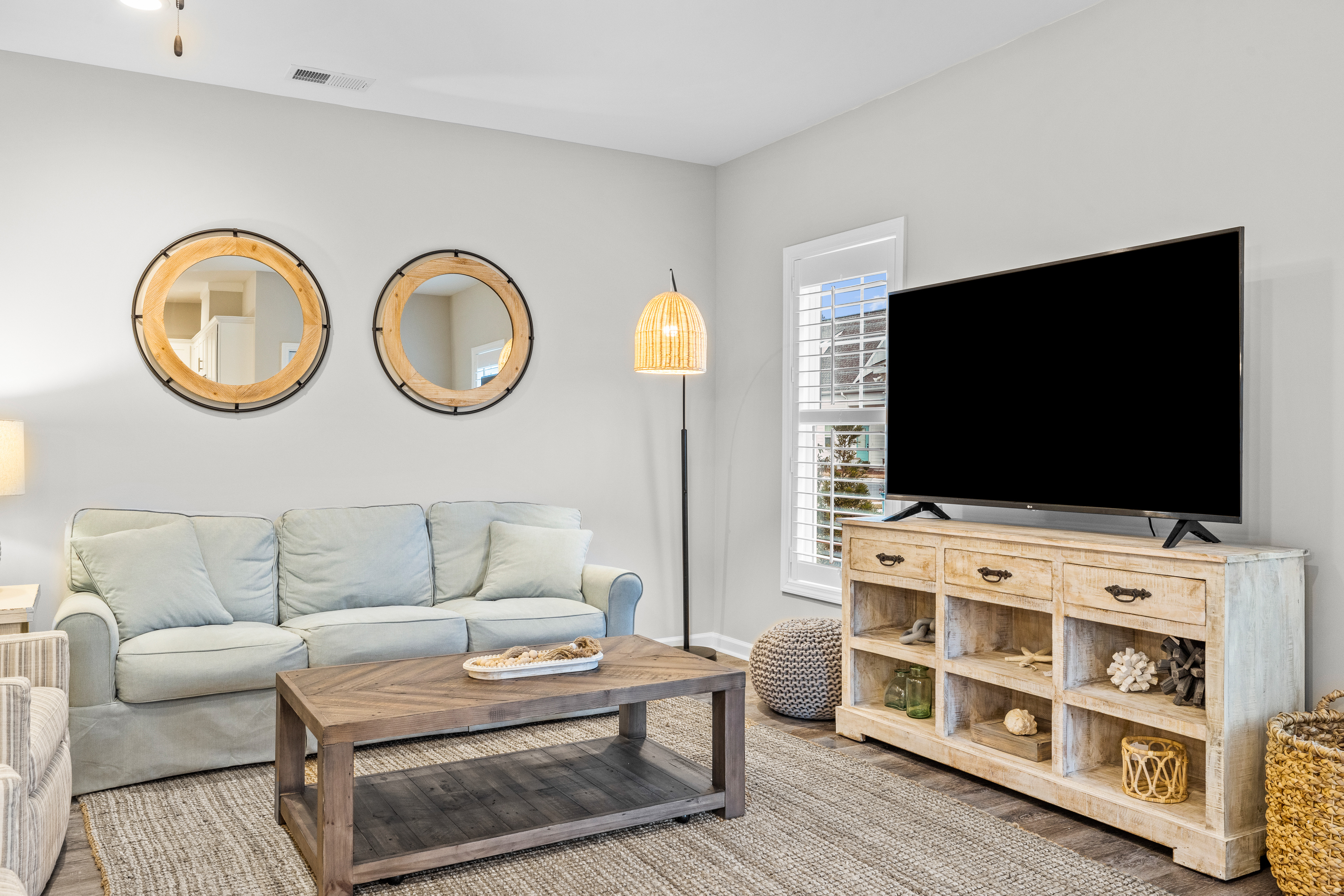 Coastal townhome with outdoor living, central AC, washer/dryer, & pool access