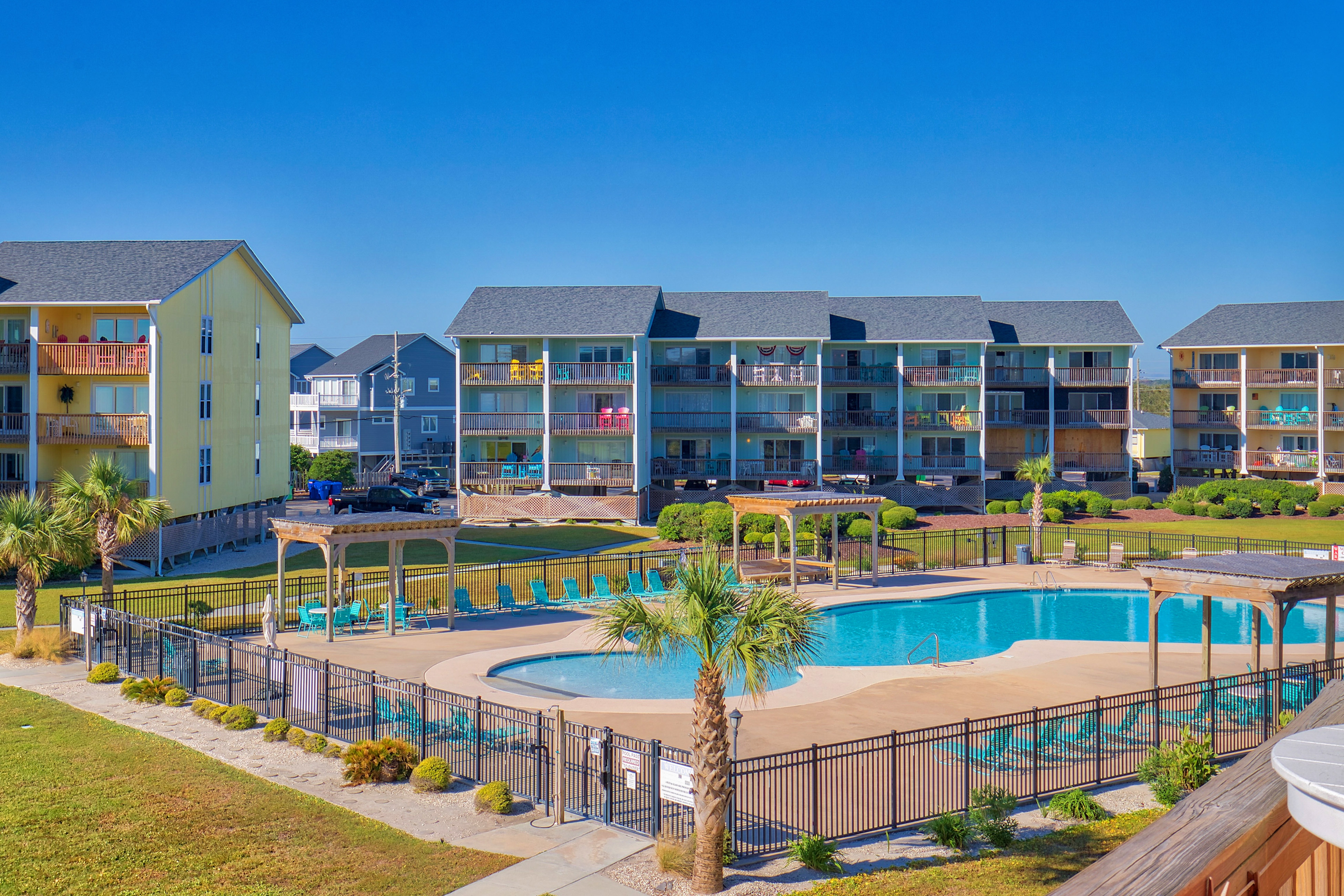 Beach condo with pool, sundecks, outdoor showers & direct beach access