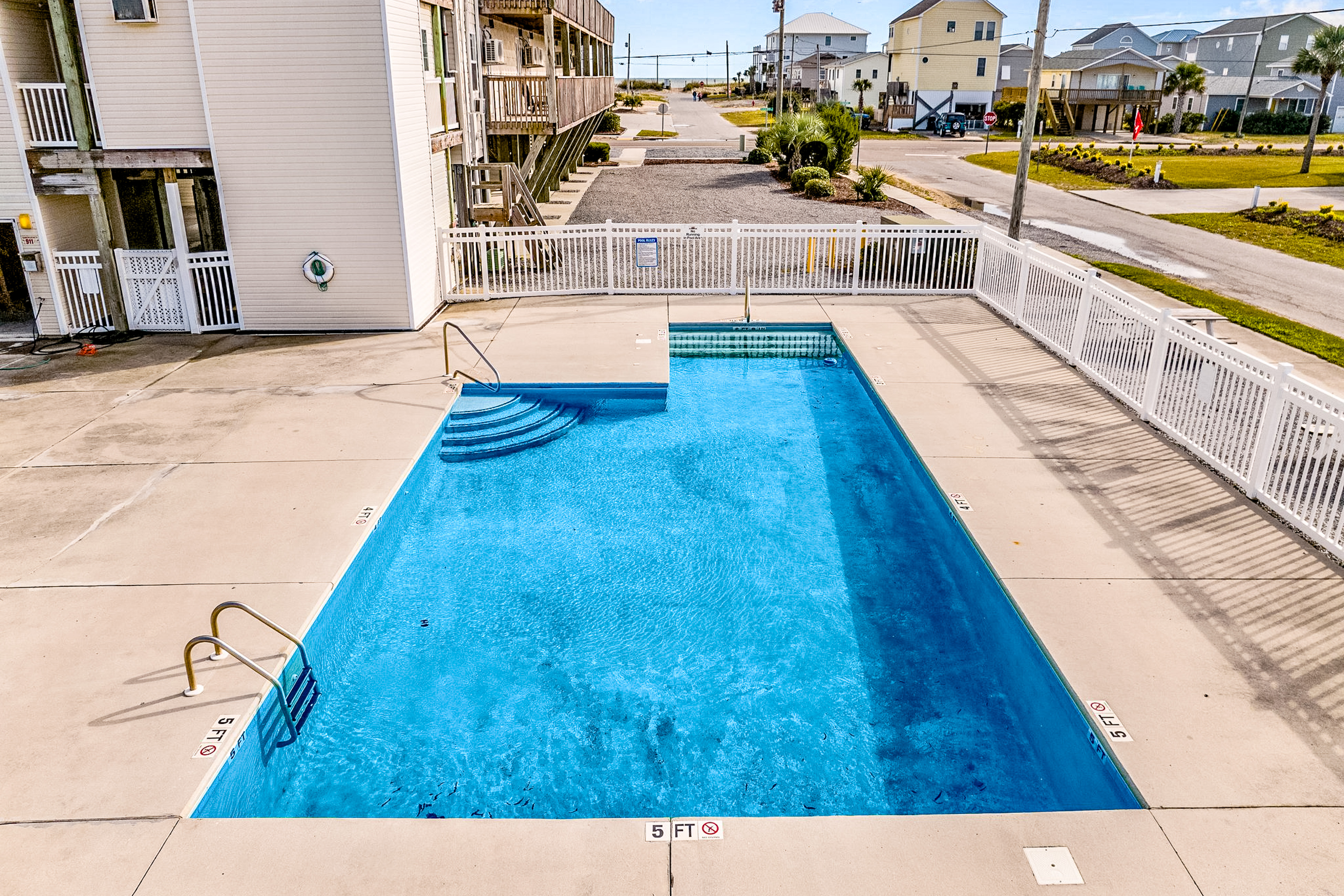 Dreamy ocean-view suite with pool, central AC, full kitchen, patio, & balcony