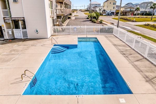 Dreamy ocean-view suite with pool, central AC, full kitchen, patio, & balcony
