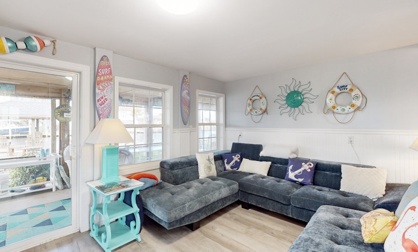 Dog-friendly waterfront home with screened-in patio, hot tub, grill, & W/D