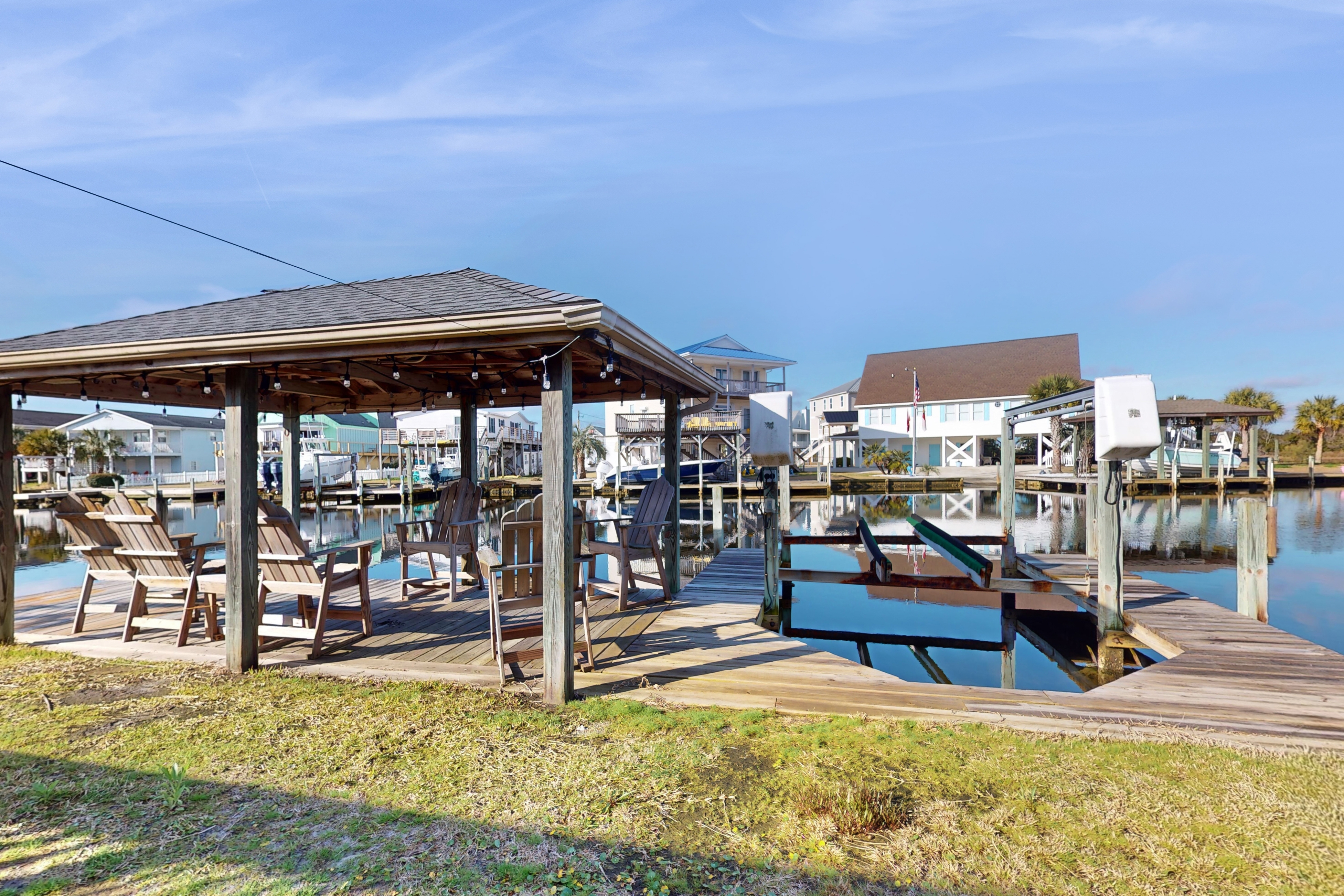 Dog-friendly waterfront home with screened-in patio, hot tub, grill, & W/D