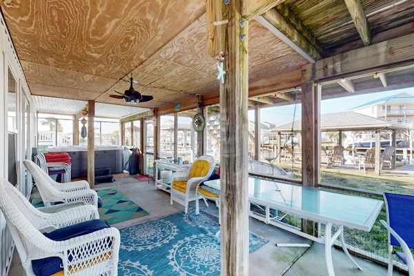 Dog-friendly waterfront home with screened-in patio, hot tub, grill, & W/D